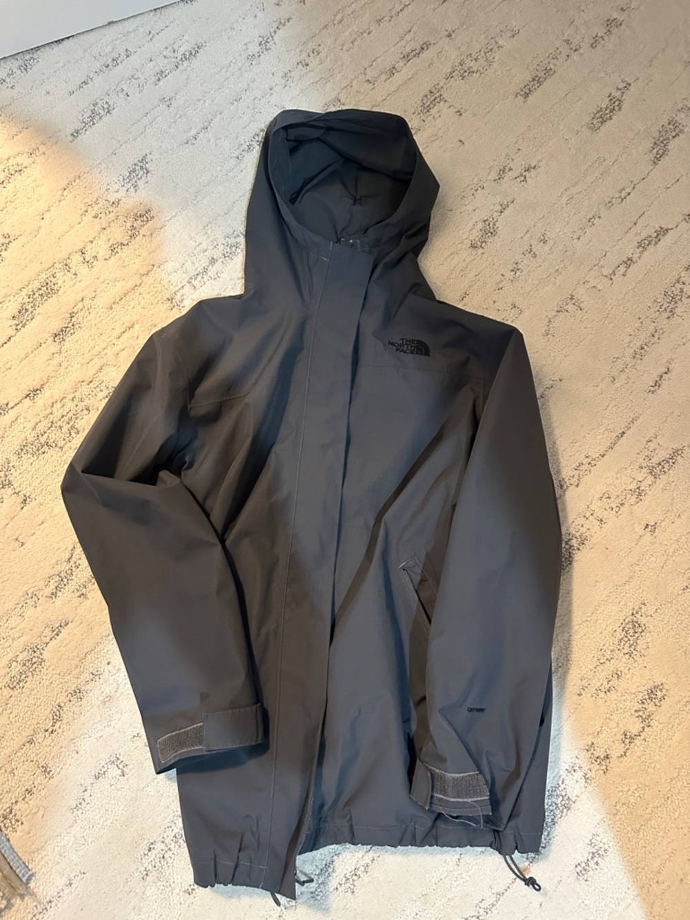Gray long north face used rain jacket/coat/windbreaker
